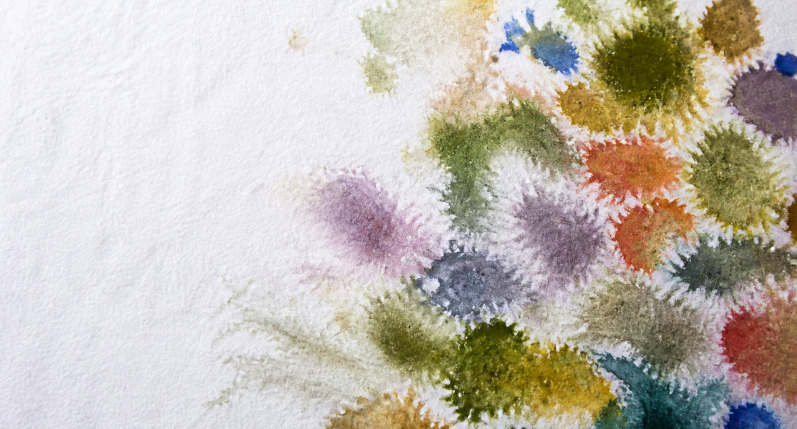 Eight pools of slightly different blues bleeding toward one another on handmade paper.